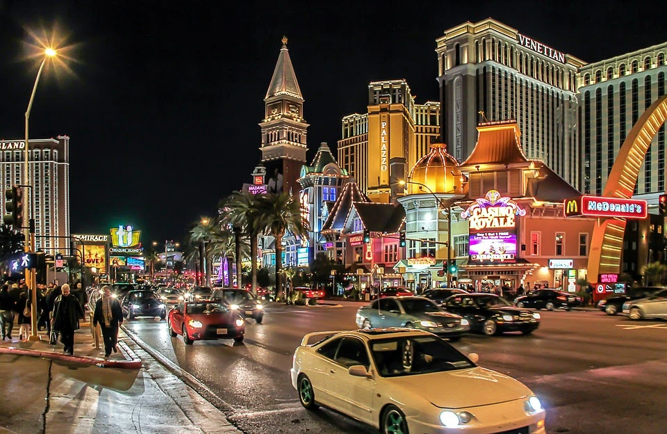 Casino strip at night with cars